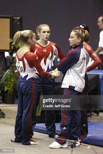 Alicia Sacramone, Katie Heenan, Allyse Ishino and Carly Patterson of the USA chat after competing in the Pacific Alliance Championships on April 16,...