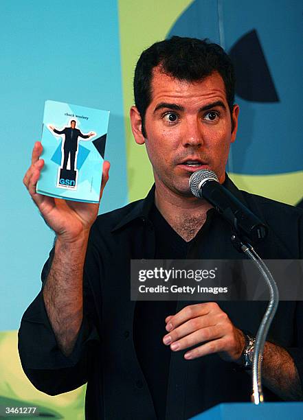 Game Show Host Graham Elwood holds up a flyer during the Get Schooled Games Tour 2004 at Powerhouse Live in Baltimore on Thursday, April 22 where one...