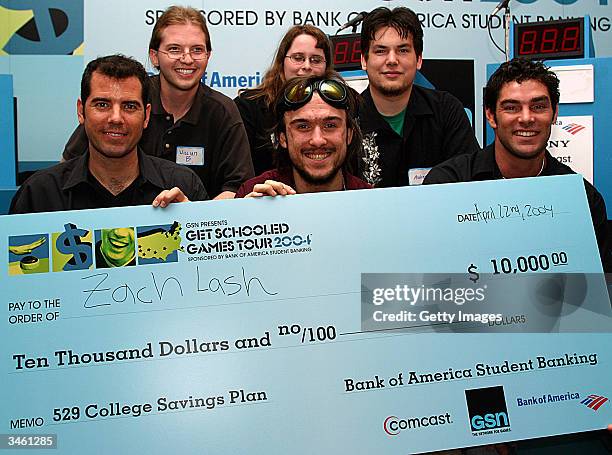 Winner Zach Lash poses with game host Graham Elwood and Actor Evan Marriott during the Get Schooled Games Tour 2004 at Powerhouse Live in Baltimore...