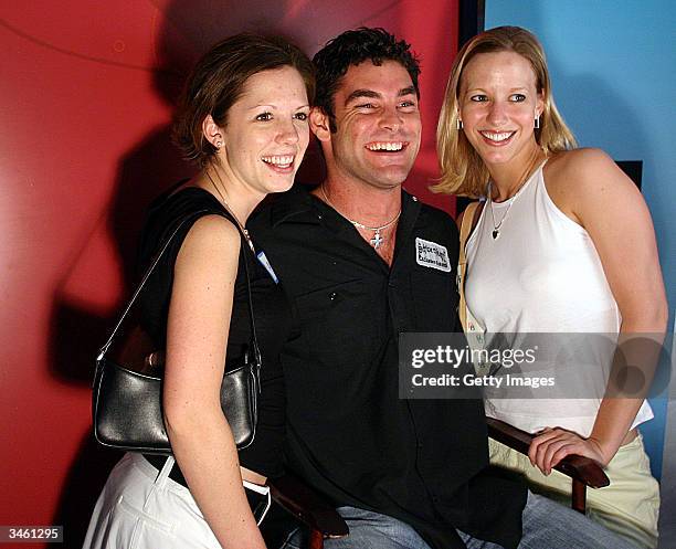 Actor Evan Marriott poses with fans during The Game Show Network hosted Get Schooled Games Tour 2004 at Powerhouse Live in Baltimore on Thursday,...