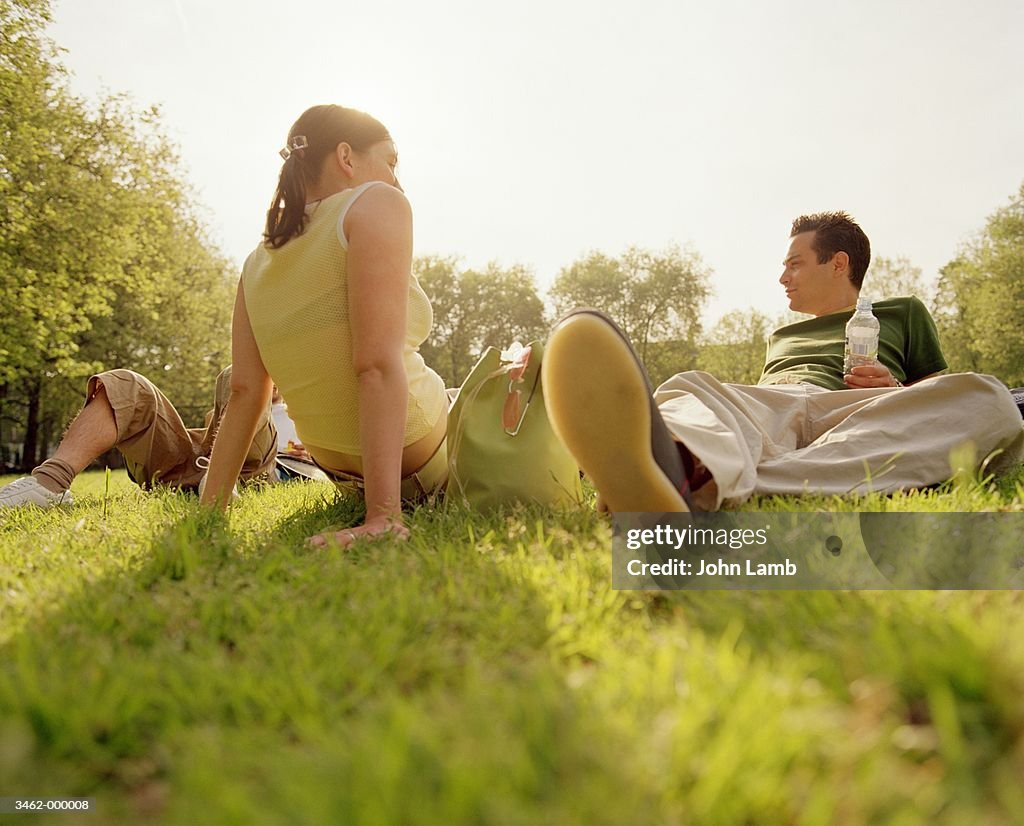 Friends Relaxing in Park