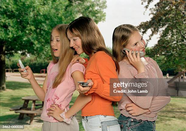girls using cellular phones - wap stock pictures, royalty-free photos & images