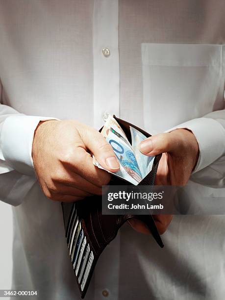 man holding wallet - twenty euro banknote stock pictures, royalty-free photos & images