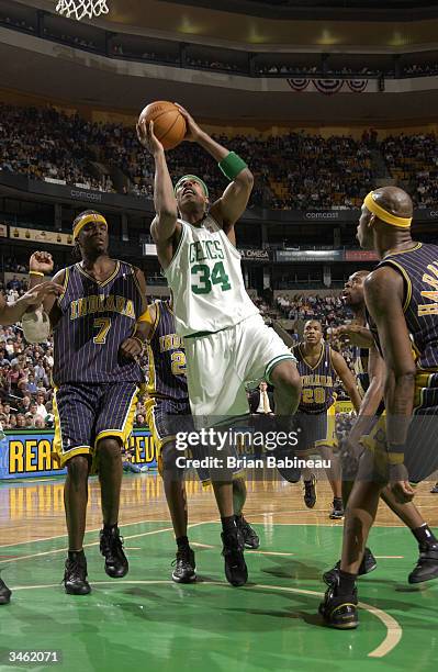 Paul Pierce of the Boston Celtics shoots against Jermaine O'Neal of the Indiana Pacers during Game three of the Eastern Conference Quarterfinals...