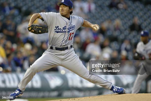 Kazuhisa Ishii of the Los Angeles Dodgers pitches during the game against the Colorado Rockies at Coors Field on April 20, 2004 in Denver, Colorado....