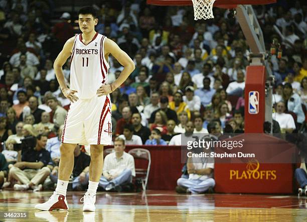 Yao Ming of the Houston Rockets waits for the action to start up again against the Los Angeles Lakers during Game three of the Western Conference...
