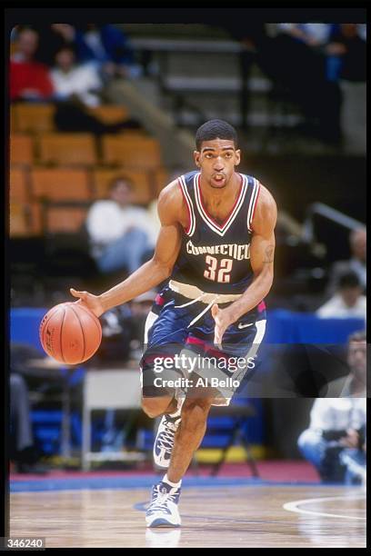 Guard Richard Hamilton of the Connecticut Huskies moves the ball during a game against the Seton Hall Pirates at the Continental Airlines Arena in...