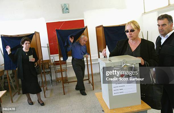 Cypriots vote in a referendum on April 24, 2004 in Nicosia, Cyprus. Greek and Turkish Cypriots are voting in twin referendums on whether to reunite...