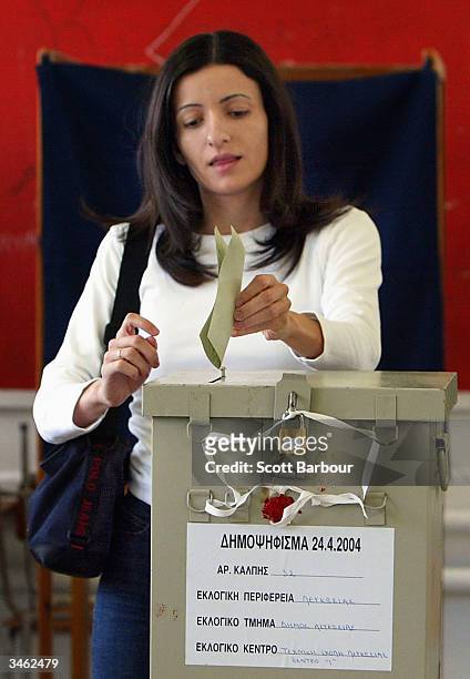 Lady votes in a referendum on April 24, 2004 in Nicosia, Cyprus. Greek and Turkish Cypriots are voting in twin referendums on whether to reunite...