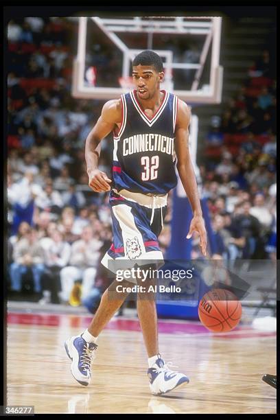 Guard Richard Hamilton of the Connecticut Huskies moves the ball during a game against the Seton Hall Pirates at the Continental Airlines Arena in...