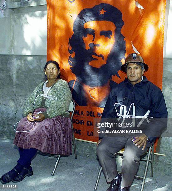 Ana Basagoitia widow of a miner and Francisco Franco tied with dynamite threaten to immolate themselves 24 April 2004 at the Miners Federation in La...