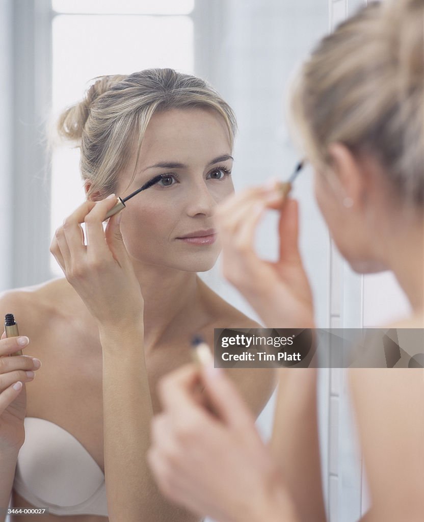 Woman Applying Eyeliner