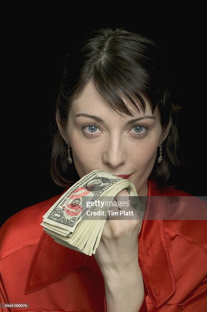 Woman Kissing Money