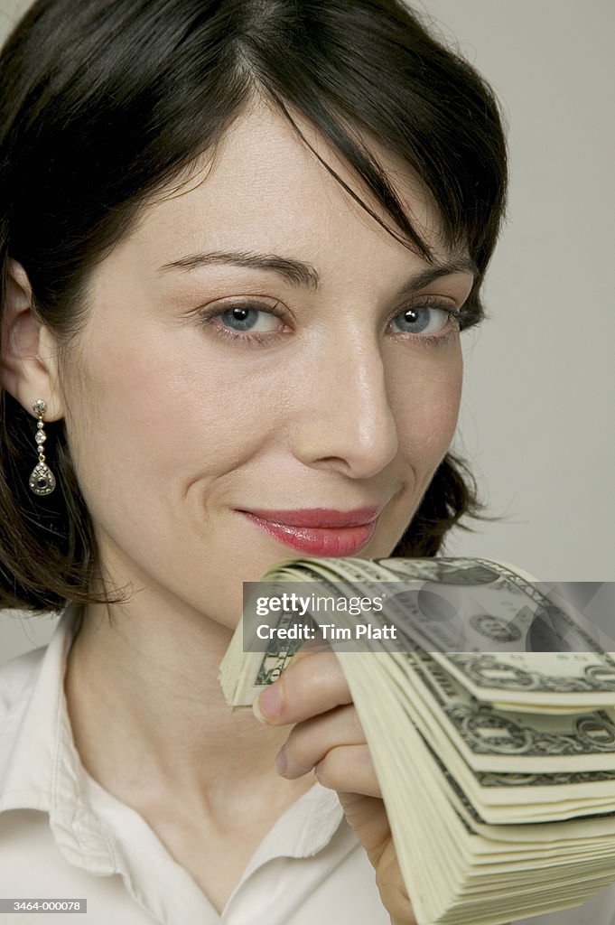 Woman Holding US Dollars