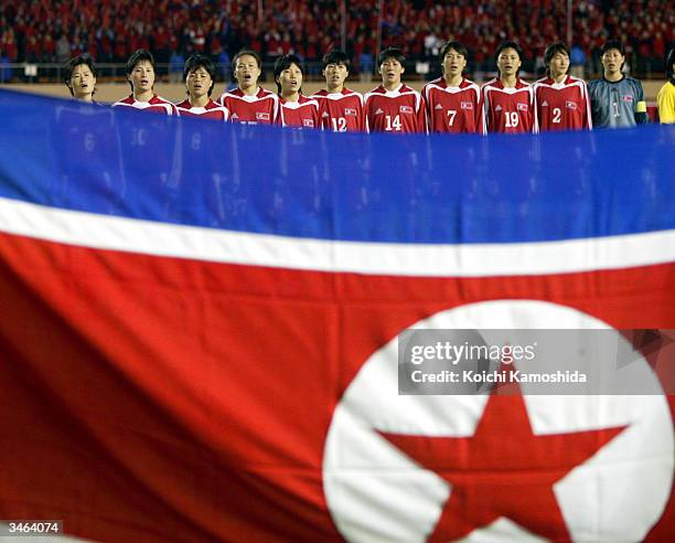 The North Korean national women's soccer team sings their national anthem prior to the AFC Olympics qualifying tournament semi-final game against...