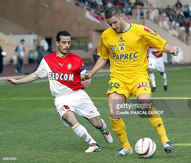 Nantes Defender Sylvain Armand is challenged by Monaco Forward Ludovic Giuly during their French l1 football match, 24 April 2004 at the Louis II...