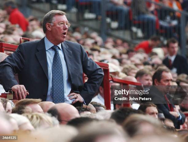 Sir Alex Ferguson of Manchester United looks annoyed in the dugout during the FA Barclaycard Premiership match between Manchester United and...