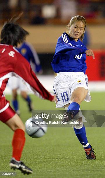 Forward Homare Sawa of the Japanese national women's soccer team, kicks the ball at the AFC Olympics qualifying tournament semi-final game against...
