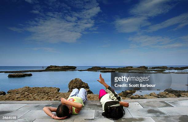 Two Turkish Cypriot children relax by the beach on April 24, 2004 in Famagusta, Cyprus. More than three-quarters of Greek Cypriots have voted against...