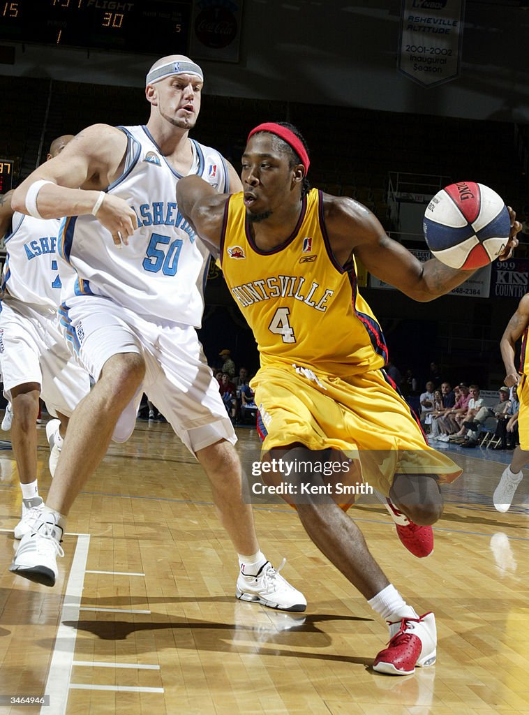 Rod Grizzard of Huntsville Flight drives against Brandon Kurtz of the