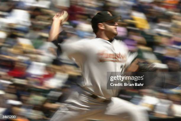 Roger Clemens of the Houston Astros delivers a pitch against the Colorado Rockies in the second inning on April 24, 2004 at Coors Field in Denver,...