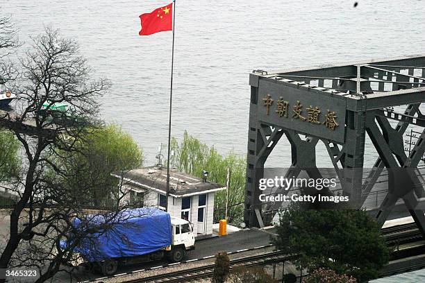 Truck carrying emergency supplies for the disaster site in Ryonchon, passes the Chinese border to North Korea at the friendship bridge in Dandong,...