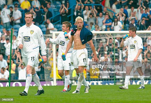 Steven Caldwell, Stephen McPhail, Alan Smith and James Milner of Leeds walk off dejectedly at the final whistle during the FA Barclaycard Premiership...