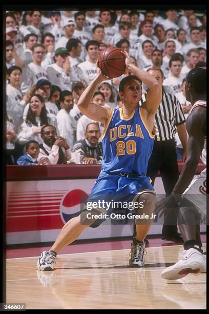 Guard Brandon Loyd of the UCLA Bruins looks to pass the ball as Stanford Cardinal guard Brevin Knight covers him during a game at Maples Pavilion in...