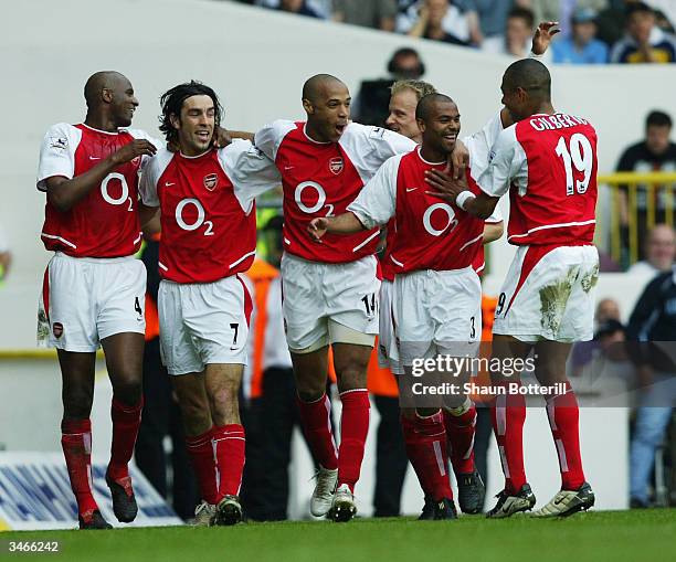 Patrick Vieira, Robert Pires, Thierry Henry, Ashley Cole and Gilberto Silva of Arsenal celebrate after the second goal during the FA Barclaycard...