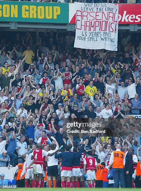 Arsenal fans applaud their team after winning the Championship in the FA Barclaycard Premiership match between Tottenham Hotspur and Arsenal at White...