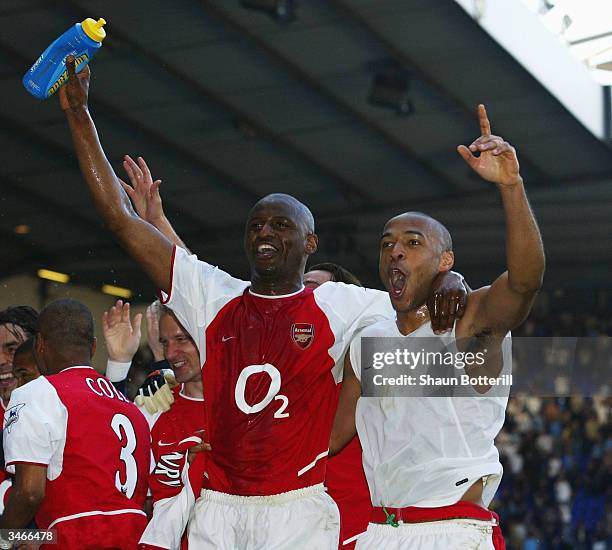Thierry Henry and Patrick Vieira of Arsenal celebrates with team-mates at the end of the FA Barclaycard Premiership match between Tottenham Hotspur...