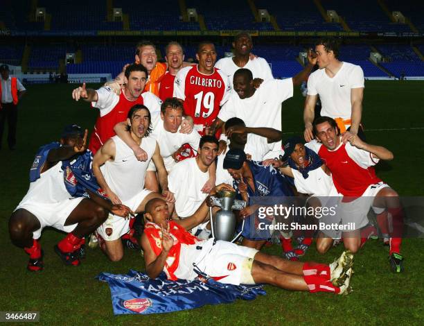 Arsenal celebrate at the end off the FA Barclaycard Premiership match between Tottenham Hotspur and Arsenal at White Hart Lane on April 25, 2004 in...