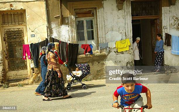 Turkish Cypriot children play in the streets a day after the referendum in the Turkish side of the divided city of Nicosia April 25, 2004 in Nicosia,...