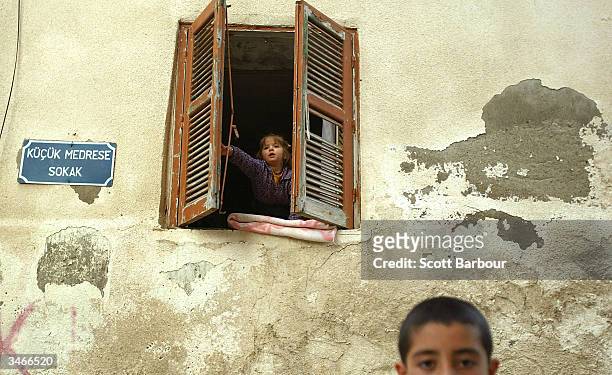 Turkish Cypriot children play in the street a day after the referendum in the Turkish side of the divided city of Nicosia April 25, 2004 in Nicosia,...