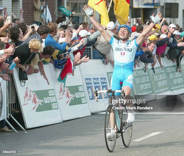 Italy's Davide Rebellin of the German team Gerolsteiner celebrates winning the Li?ge-Bastogne-Li?ge cycle race a UCI World Cup Event on April 25,...