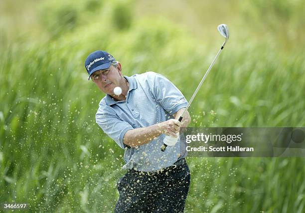 Hale Irwin plays a bunker shot on the eighth hole during the final round of the Liberty Mutual Legends of Golf at the Club at Savannah Harbor on...