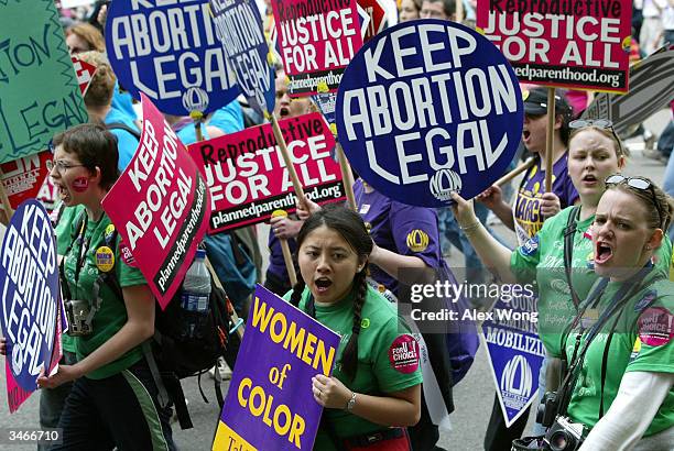 Pro-choice activists shout slogans as they take part in the March For Women's Lives April 25, 2004 in Washington, DC. Hundreds of thousands of...