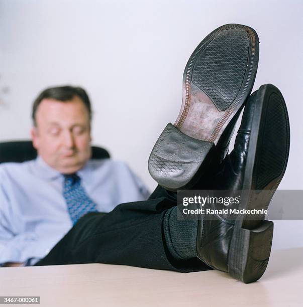 businessman with feet on desk - sole of shoe stock pictures, royalty-free photos & images