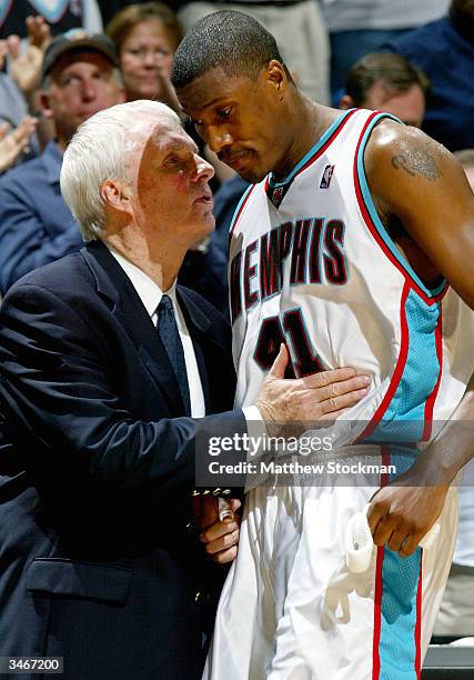 Coach Hubie Borwn of the Memphis Grizzlies talks with James Posey as he leaves the game in the last minute against the San Antonio Spurs during Game...
