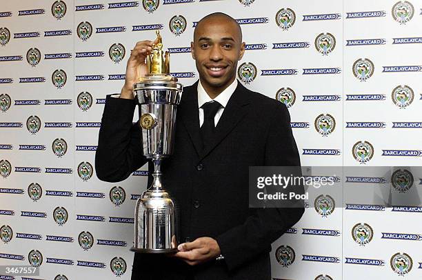 Thierry Henry of Arsenal poses with the PFA Players Player Of The Year Award at the PFA Awards Dinner at the Grosvenor House Hotel on April 25, 2004...