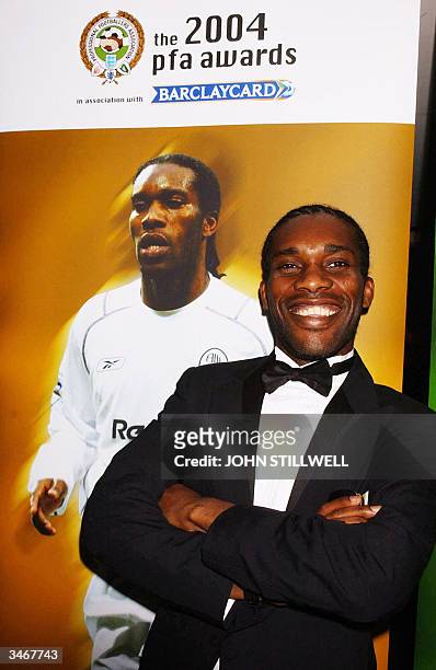 Bolton's Jay Jay Okocha arrives at the PFA Awards Dinner at the Grosvenor House Hotel in central London, on 25 April 2004. The Nigerian midfielder...