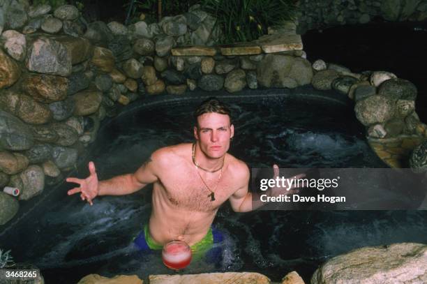 White rapper Vanilla Ice in his jacuzzi at home, circa 1990.