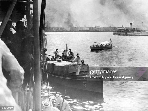 Inhabitants of Smyrna escape by boat after the city is attacked by Turkish forces under Mustapha Kemal Ataturk, September 1922.