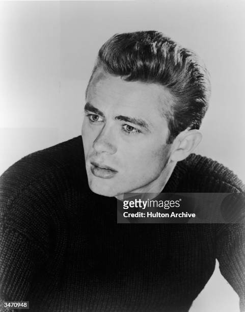 Portrait of American film actor James Dean dressed in a dark-colored sweater, early 1950s.