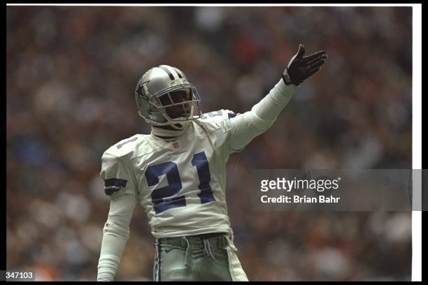 Defensive back Deion Sanders of the Dallas Cowboys celebrates during a game against the Washington Redskins at Texas Stadium in Irving, Texas. The...