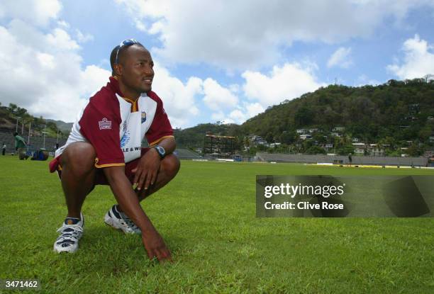 Brian Lara tests the conditions of the water logged pitch pior to the 4th One Day International at Queens Park, on April 27 in St Georges, Grenada.