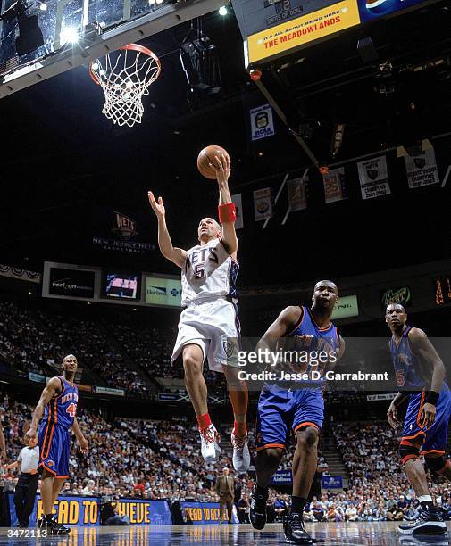 Jason Kidd of the New Jersey Nets lays the ball up in front of Frank Williams of the New York Knicks during Game 1 of the Eastern Conference Playoffs...