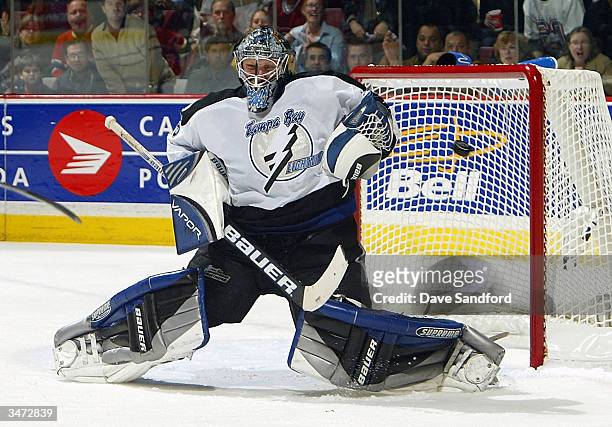 Nikolai Khabibulin of the Tampa Bay Lightning makes a save on a shot from the Montreal Canadiens in Game three of the Eastern Conference Semifinals...