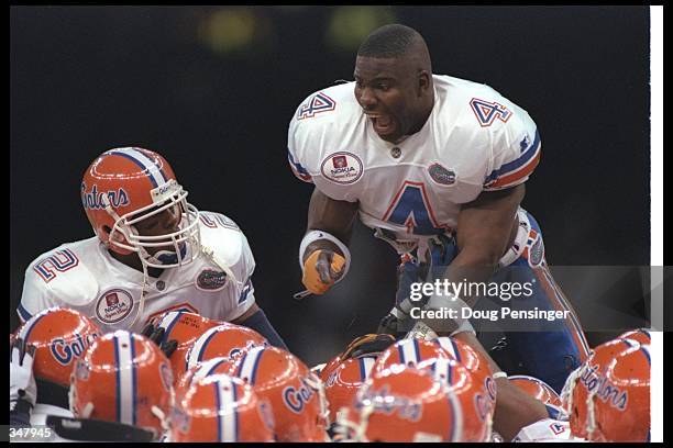 Florida Gators defensive backs Shea Showers and Lawrence Wright celebrate with teammates during the Nokia Sugar Bowl against the Floirda State...