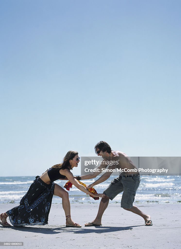 Couple Playing on Beach